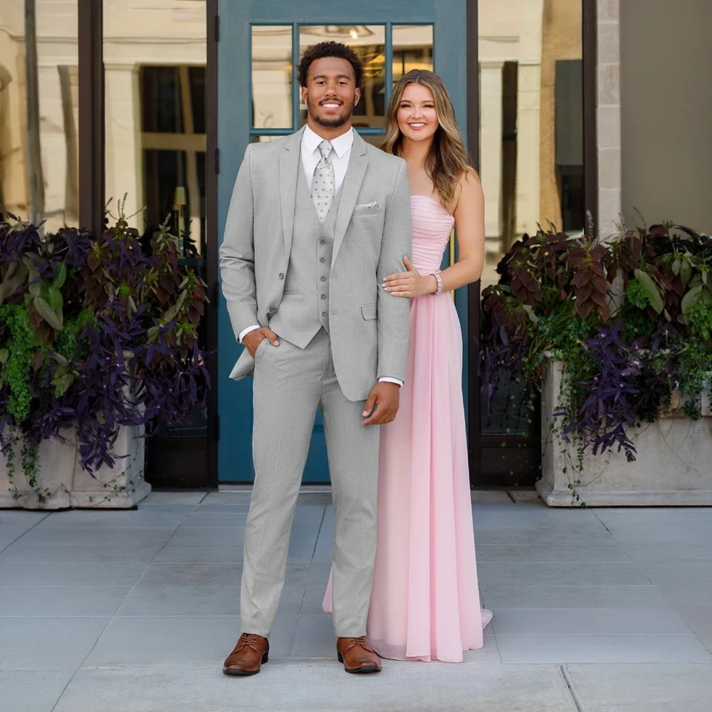 Model wearing a tuxedo.