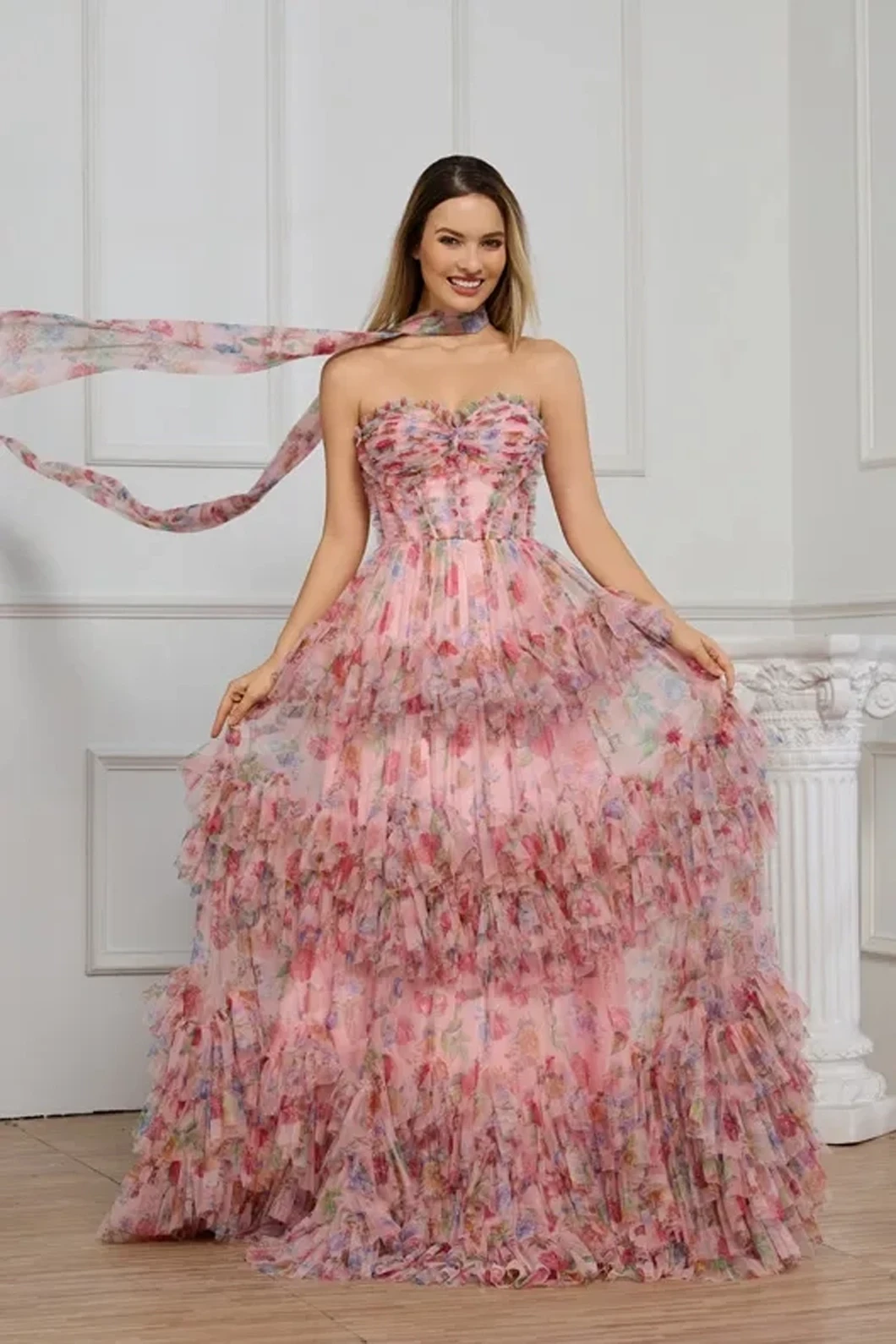 Model wearing a red prom gown.