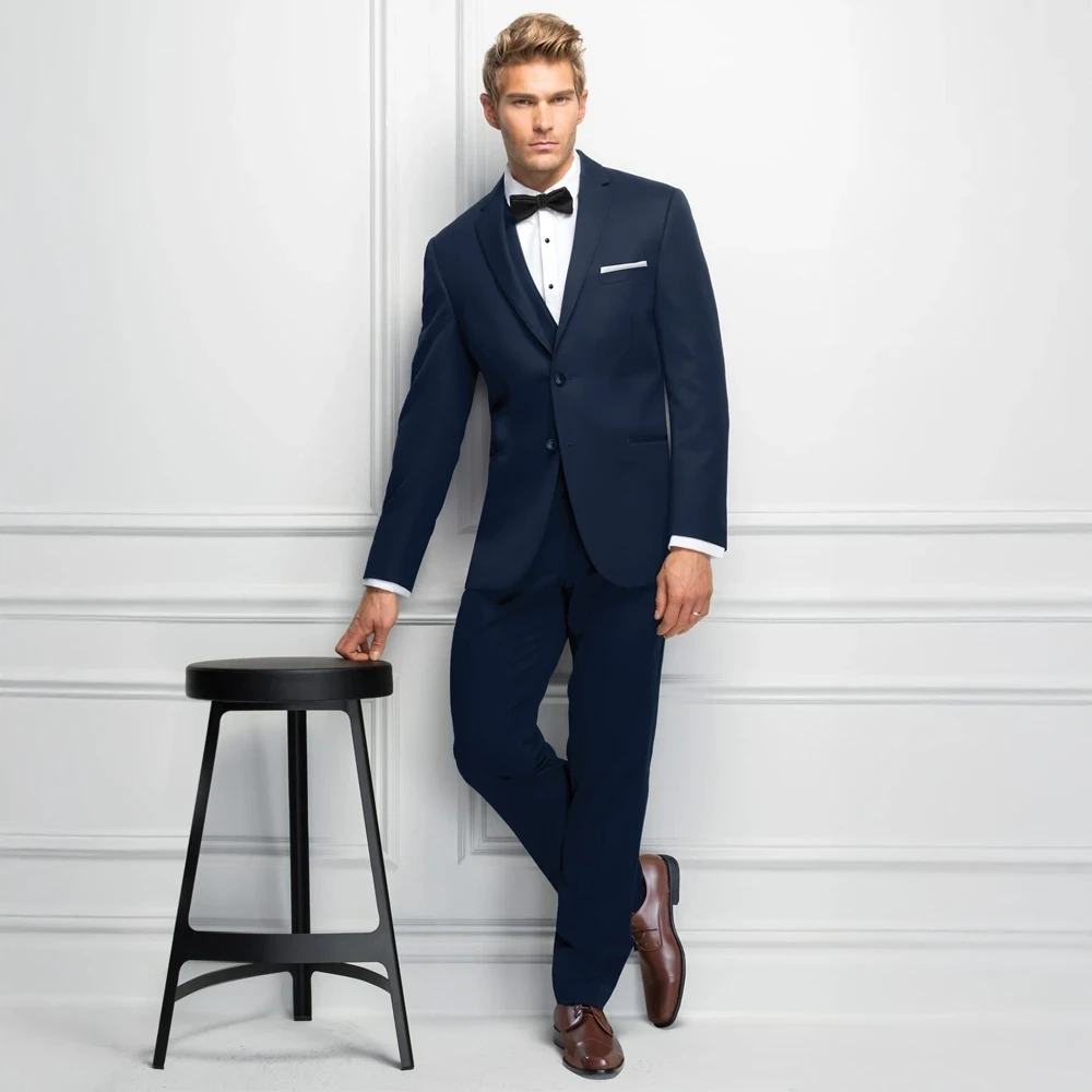 Model wearing a tuxedo.