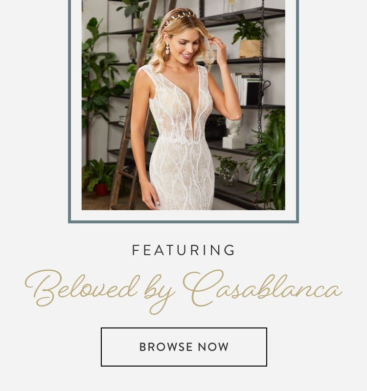 Model wearing lace fitted Beloved by Casablanca wedding dress shown on mobile device